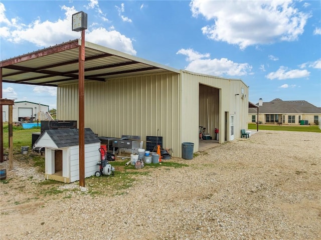 view of side of property with an outdoor structure