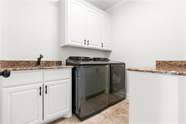 laundry area featuring cabinets, ornamental molding, sink, light tile patterned floors, and independent washer and dryer