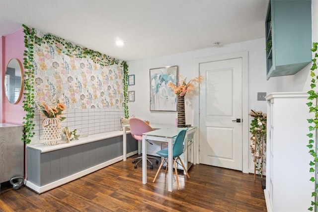 dining area featuring dark wood-type flooring