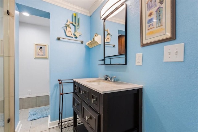 full bath featuring a shower, ornamental molding, vanity, tile patterned flooring, and baseboards