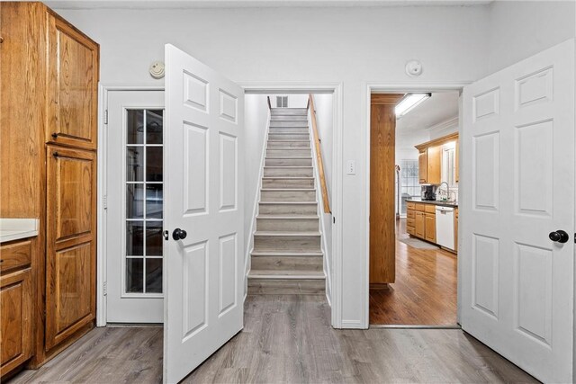 stairway featuring wood-type flooring