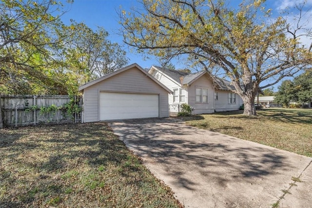 ranch-style home with a front lawn and a garage