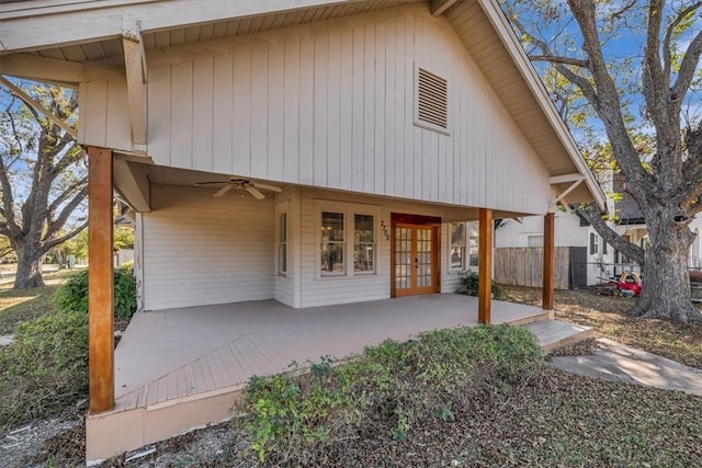 back of property featuring a patio area, ceiling fan, and french doors