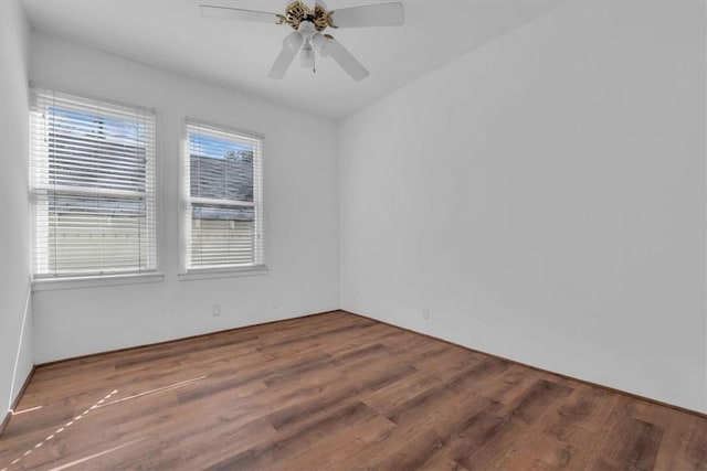 spare room featuring ceiling fan and wood-type flooring