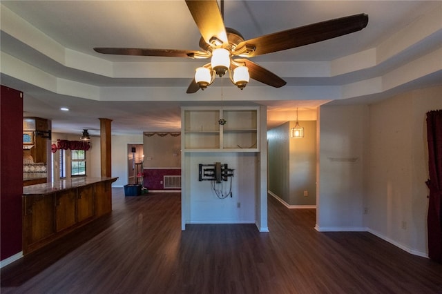 kitchen featuring ceiling fan and dark wood-type flooring