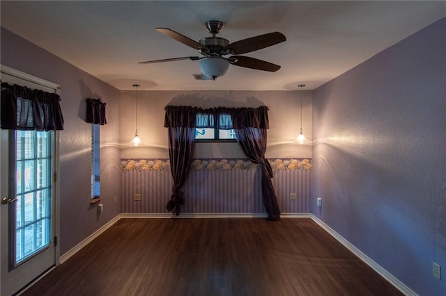 unfurnished room with ceiling fan and wood-type flooring