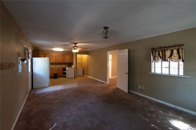 unfurnished living room with carpet and ceiling fan