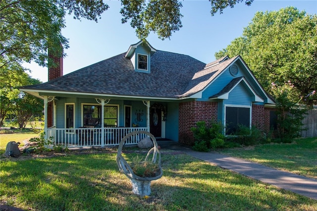 view of front of home with a front lawn and covered porch