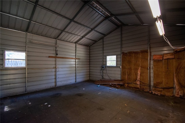 garage featuring wooden walls