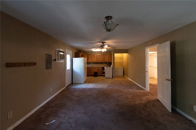 unfurnished living room featuring light carpet, electric panel, and ceiling fan