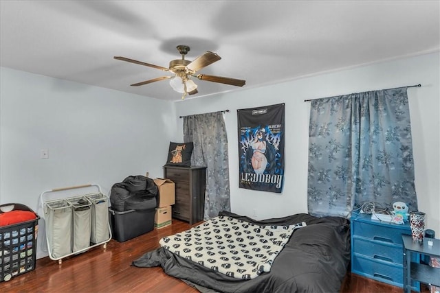 bedroom with ceiling fan and dark hardwood / wood-style floors