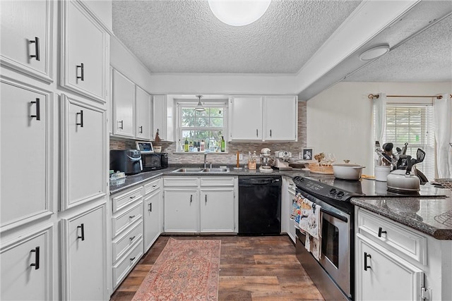 kitchen with dishwasher, a wealth of natural light, white cabinetry, and stainless steel range with electric stovetop