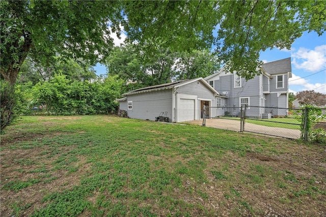 view of yard with a garage and an outdoor structure