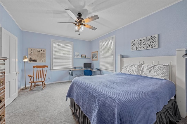 carpeted bedroom featuring ceiling fan, crown molding, and multiple windows