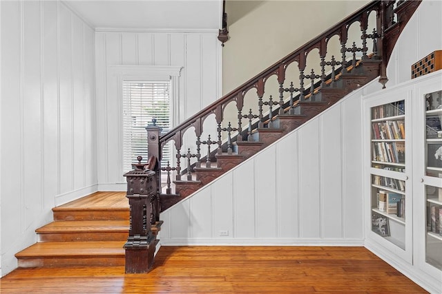 staircase featuring hardwood / wood-style floors