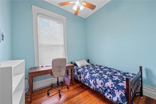 bedroom with hardwood / wood-style flooring and ceiling fan