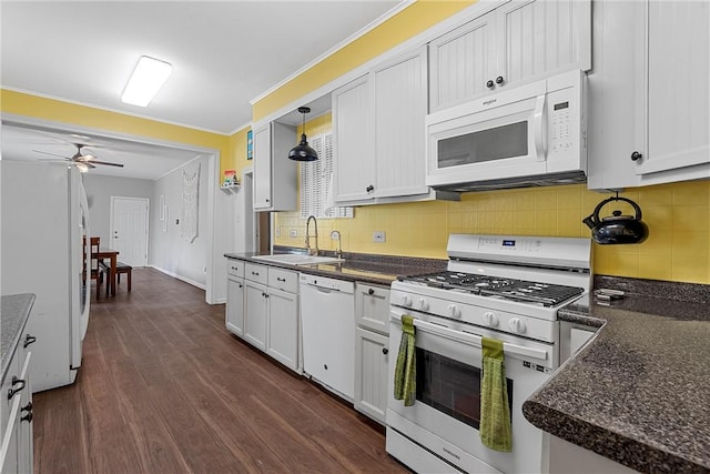 kitchen featuring white cabinetry, dark wood-type flooring, pendant lighting, and white appliances