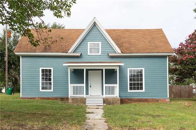 view of front facade with a front lawn and a porch