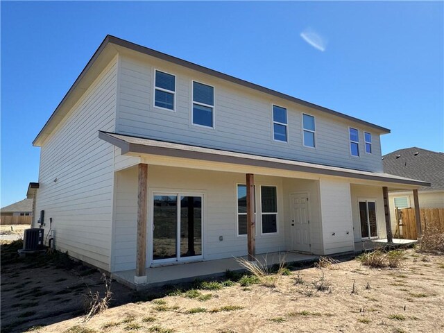 back of property with a patio and central AC unit