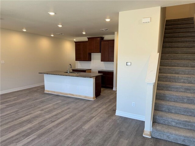 unfurnished bedroom featuring light colored carpet and a closet