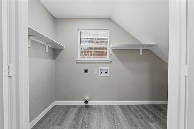 clothes washing area with hookup for a washing machine, electric dryer hookup, and dark wood-type flooring