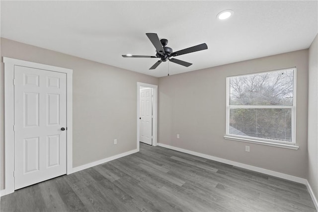 unfurnished bedroom with hardwood / wood-style flooring and ceiling fan