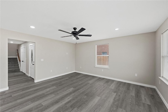 unfurnished room with ceiling fan and dark hardwood / wood-style floors