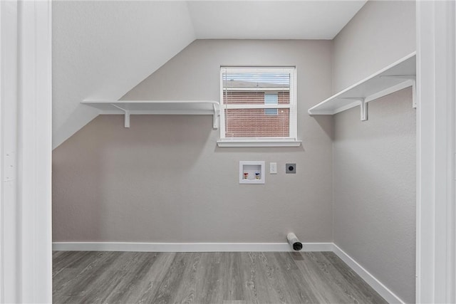 laundry area with hardwood / wood-style flooring, hookup for an electric dryer, and hookup for a washing machine