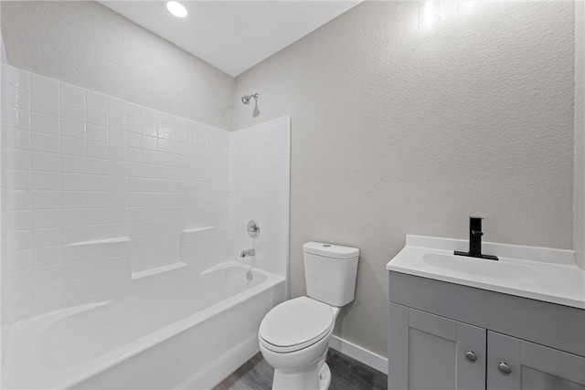 full bathroom featuring vanity, shower / tub combination, and toilet