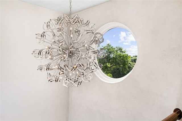 interior details featuring a chandelier