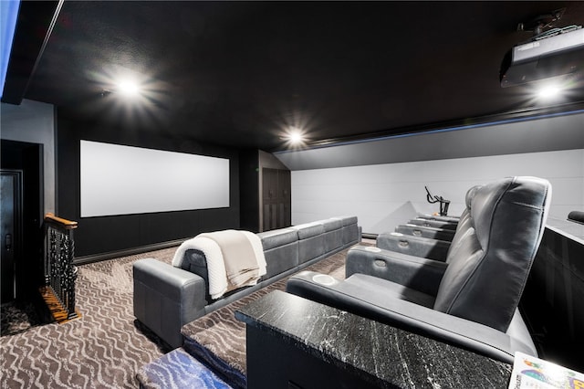 home theater room with carpet and lofted ceiling