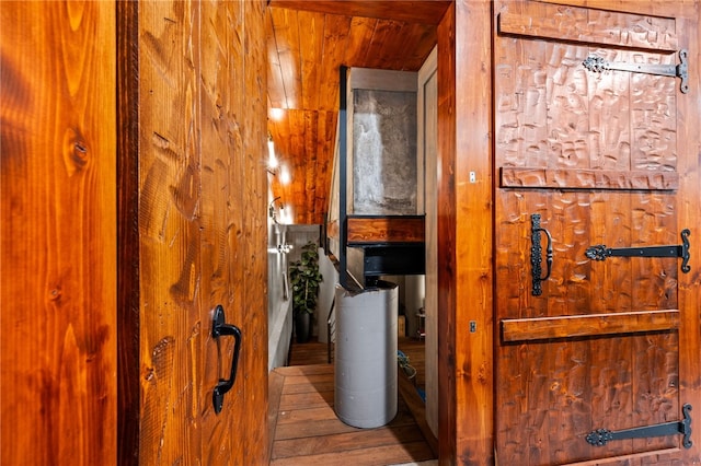 bathroom featuring hardwood / wood-style flooring, wood walls, and wood ceiling