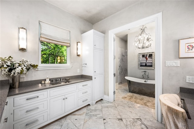 bathroom featuring vanity and a bath