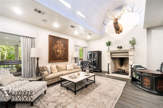 living room with a wealth of natural light and hardwood / wood-style flooring