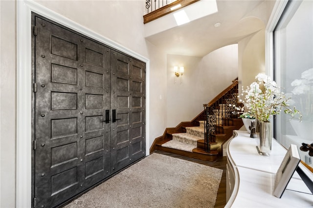 entrance foyer with vaulted ceiling