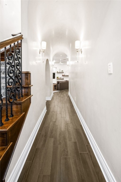 corridor featuring dark wood-type flooring