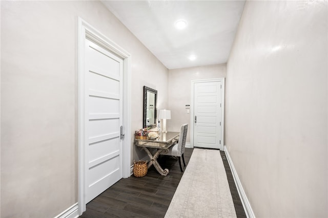 hallway featuring dark wood-type flooring