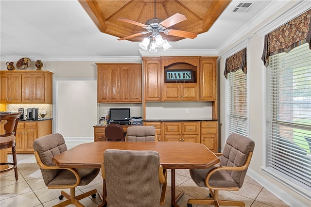 dining room featuring ceiling fan, light tile patterned floors, and ornamental molding