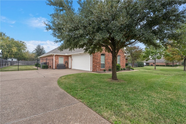 view of front of home with a front yard and a garage