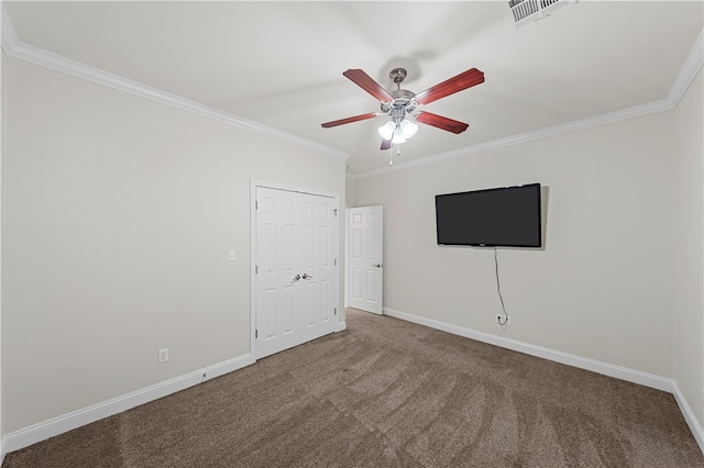 interior space with crown molding, carpet, and ceiling fan