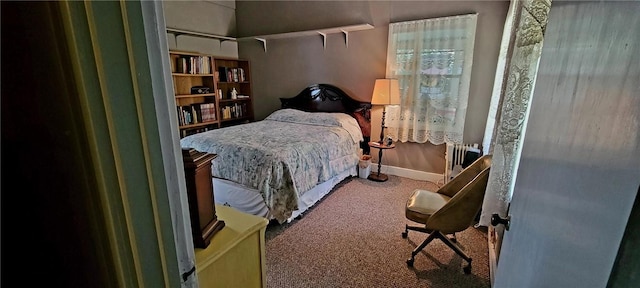 bedroom with carpet and radiator