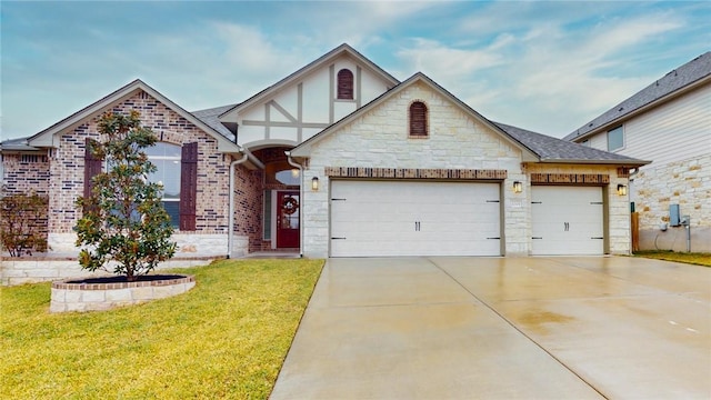 view of front of property with a garage and a front lawn