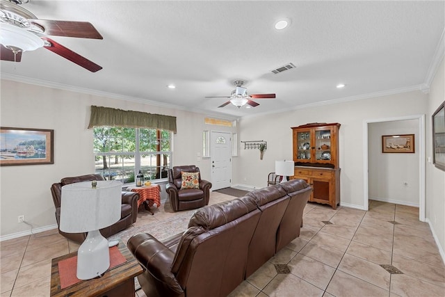 living room featuring ceiling fan, light tile patterned flooring, and ornamental molding