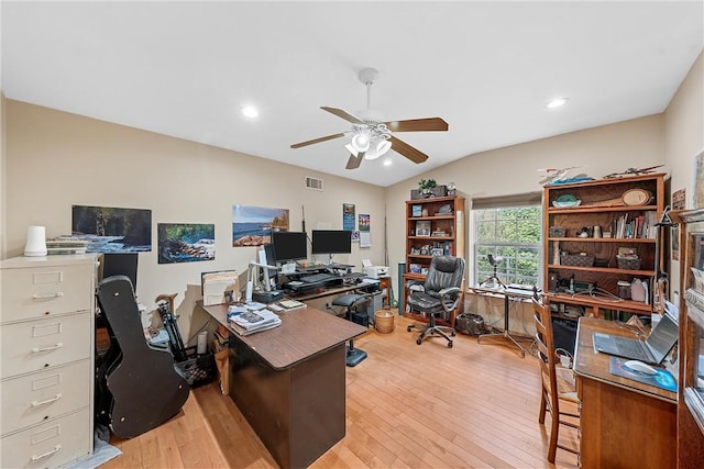 office featuring light hardwood / wood-style floors, ceiling fan, and lofted ceiling