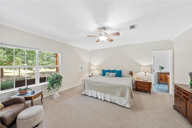 bedroom featuring light carpet, a textured ceiling, ceiling fan, and ornamental molding