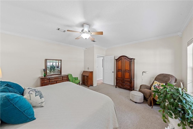 carpeted bedroom with ceiling fan and crown molding