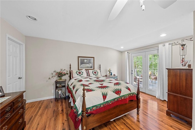 bedroom with hardwood / wood-style flooring and access to exterior