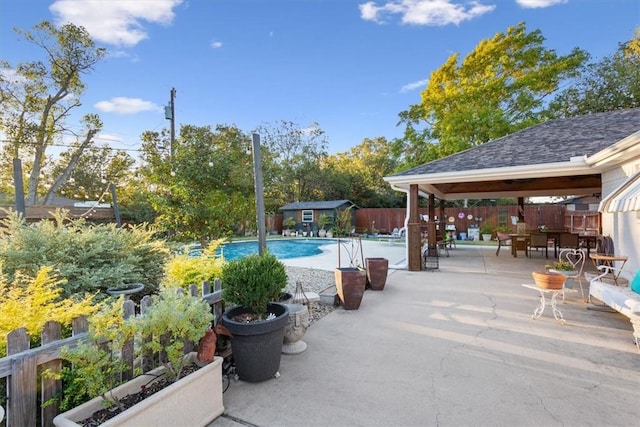 view of pool with a gazebo, a patio, and an outdoor structure