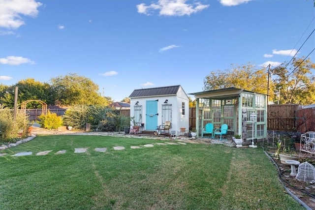 exterior space with a yard and a storage shed