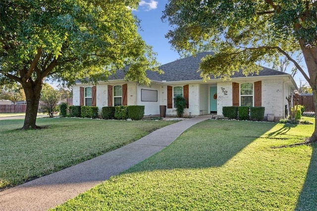 ranch-style house featuring a front lawn